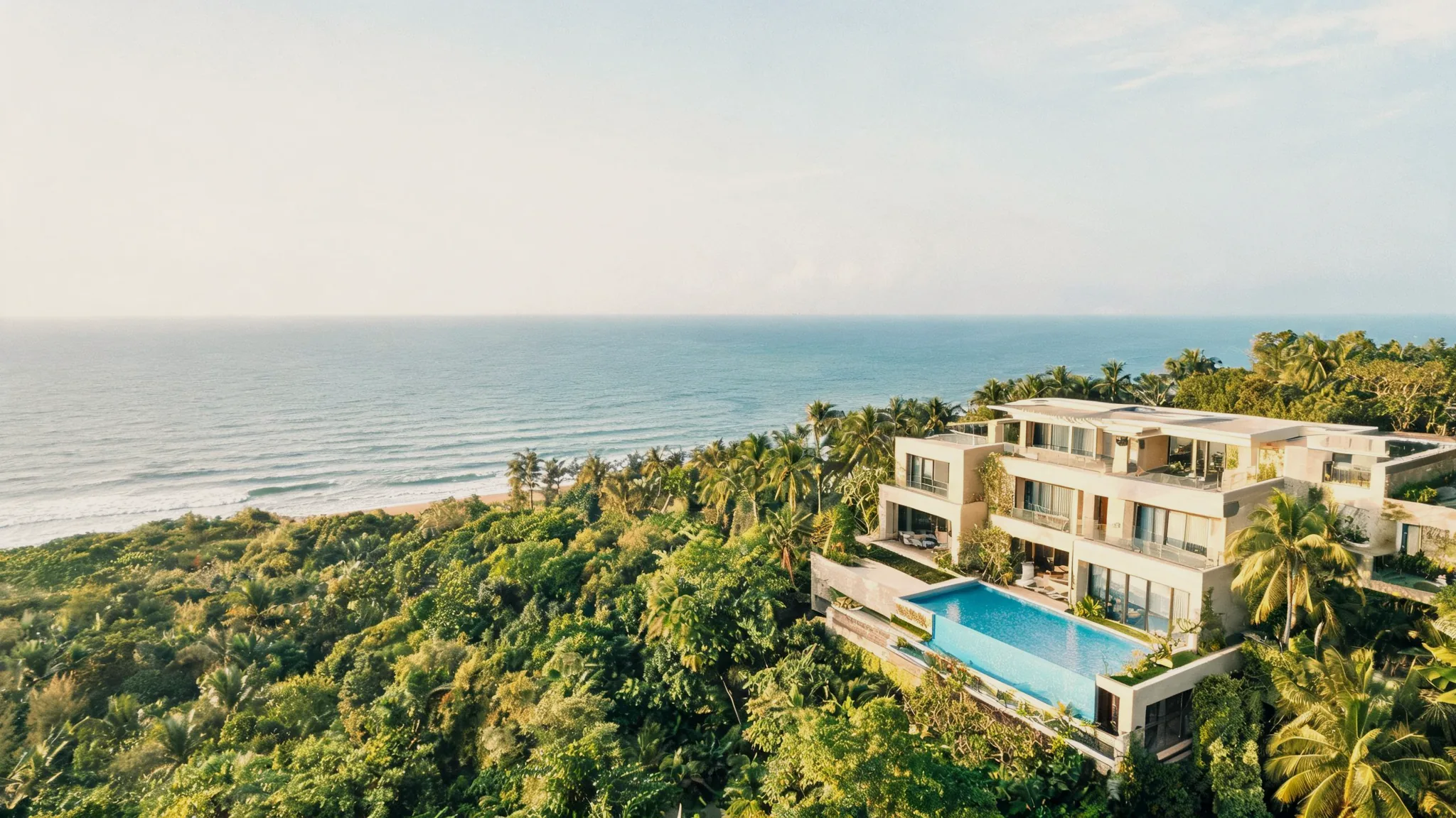 Aerial view of a luxury villa above the coast (placeholder)