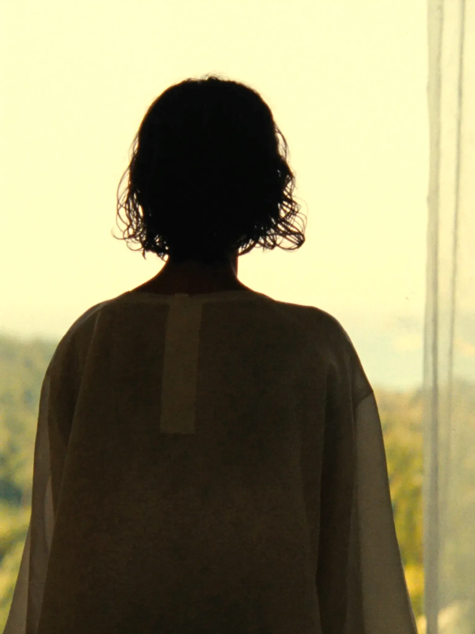 A guest looking out a suite window (placeholder)